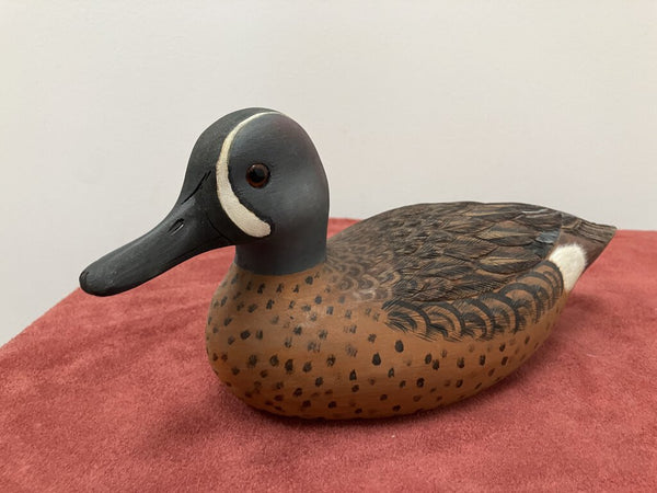 Carved wooden ducks, signed by artist
