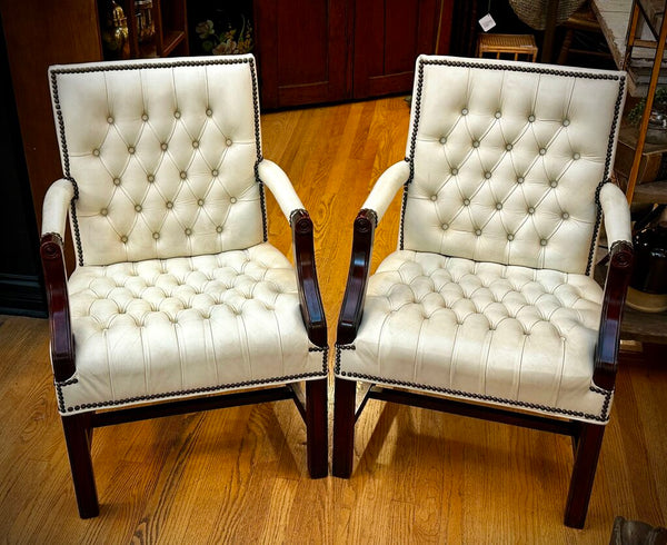 PAIR OF JASPER SEATING ANILINE-DYED WHITE LEATHER AND WOOD TUFTED ARMCHAIRS WITH BRASS NAILHEAD TRIM, AS FOUND. 35"H x 27"D x 24"W. IN STORE PICKUP.
