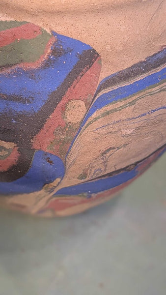 Tan with blue and pink Ozark roadside pottery approximately 7 inches