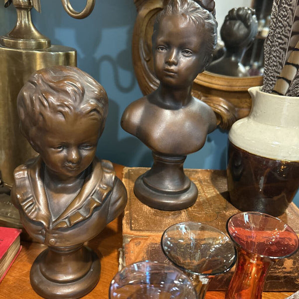 BRONZE PAINTED CHALKWARE CHILD BUSTS SET