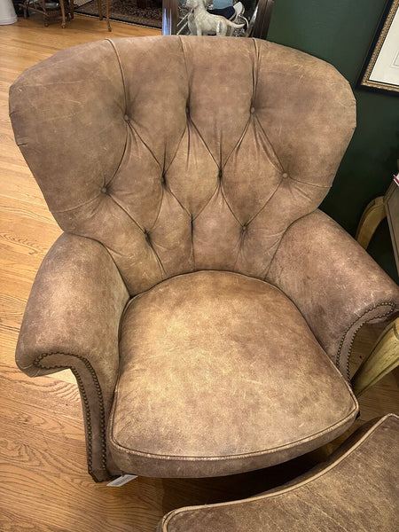 DISTRESSED LEATHER WRITER'S CHAIR AND OTTOMAN, NAILHEAD TRIM. FROM PEABODY’S, MEQUON, WI. 39"H x 37"W x 40"D, OTTOMAN DIM: 26"W x 22"D x 17"H, IN STORE PICKUP