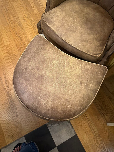 DISTRESSED LEATHER WRITER'S CHAIR AND OTTOMAN, NAILHEAD TRIM. FROM PEABODY’S, MEQUON, WI. 39"H x 37"W x 40"D, OTTOMAN DIM: 26"W x 22"D x 17"H, IN STORE PICKUP